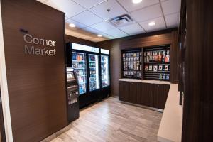 a store aisle with a corner market sign and drinks at Fairfield Inn & Suites Atlanta Airport North in Atlanta