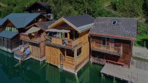 an aerial view of a house on the water at Chalet´s am See in St. Wolfgang