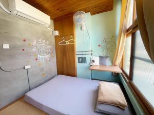 Letto o letti in una camera di Fuqi Hostel - Heping