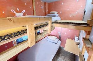 Letto o letti in una camera di Fuqi Hostel - Heping