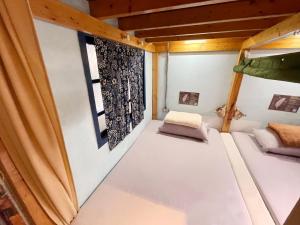Postel nebo postele na pokoji v ubytování Fuqi Hostel - Heping