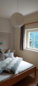 A bed or beds in a room at Panorama Erlebnis
