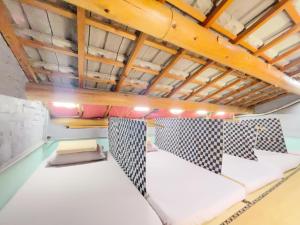 Letto o letti in una camera di Fuqi Hostel - Heping