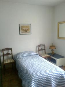 Een bed of bedden in een kamer bij Appartamento Condominio Panoramica