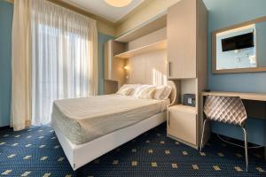Postel nebo postele na pokoji v ubytování Hotel Augustus