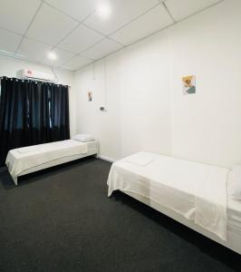 Кровать или кровати в номере AK Greenrise Meru