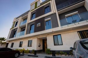 a building with cars parked in front of it at ملاذ 1 in Riyadh