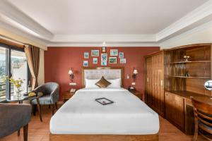 Postel nebo postele na pokoji v ubytování Tiger Sapa hotel