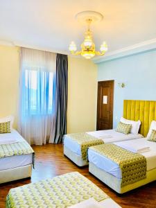 Кровать или кровати в номере Phazisi Hotel