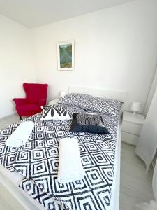 En eller flere senge i et værelse på 19 Gdynia Centrum - Apartament Mieszkanie dla 8 os