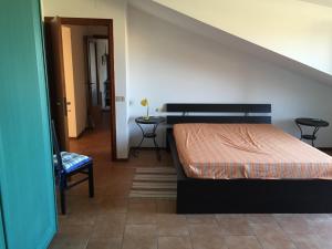 En eller flere senge i et værelse på Mansarda Mare