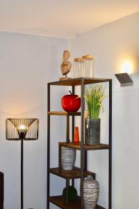 a shelf with vases and a lamp in a room at Bedford Hotel & Congress Centre in Brussels