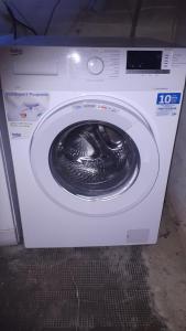 a washing machine is sitting in a room at Ferienwohnung DaWi Röhrenfurth in Melsungen