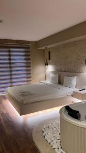 Postel nebo postele na pokoji v ubytování Avwan Hotel Çiğli
