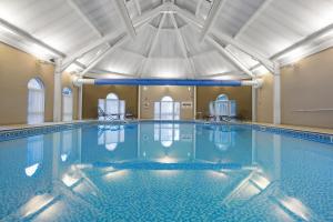 a large swimming pool in a building at Wychnor Park Country Club in Barton under Needwood