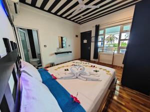 Postel nebo postele na pokoji v ubytování Dhonfulhafi Beach View + 37 fotografií