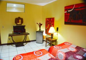 Voodi või voodid majutusasutuse Hotel Plaza Cosiguina toas