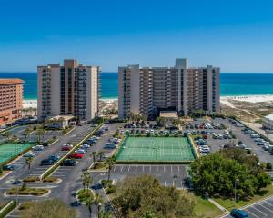 an aerial view of a parking lot with a tennis court at Phoenix East 904 in Orange Beach