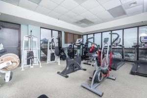 a gym with treadmills and cardio equipment in a building at Phoenix East 904 in Orange Beach