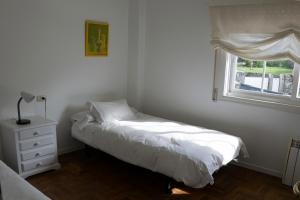 Кровать или кровати в номере Maravilloso apartamento con vistas al mar