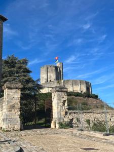 a castle with a flag on top of it at Chez Tobi in Bazincourt-sur-Epte