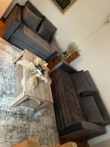 a living room with a couch and a table at Beo shooping centar in Belgrade