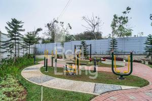 a playground in a park with at RedLiving Apartemen RQ at Ecohome Citra Raya in Nalagat +9 photos