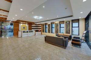 a lobby with couches and chairs in a building at Click Hotel Sagar Plaza Chakan, Pune in Chakan +37 photos