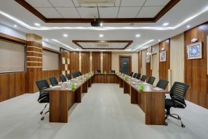 a conference room with a long table and chairs at Click Hotel Sagar Plaza Chakan, Pune in Chakan