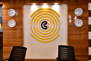 a wall with a target with clocks on it at Click Hotel Sagar Plaza Chakan, Pune in Chakan