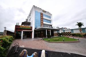 a building with people standing in front of it at Click Hotel Sagar Plaza Chakan, Pune in Chakan