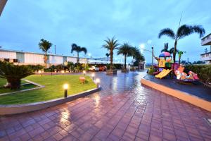 a park with a slide and a playground at Click Hotel Sagar Plaza Chakan, Pune in Chakan