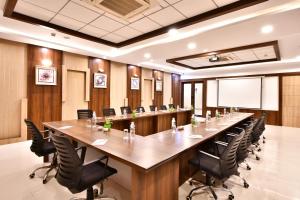 a large conference room with a long table and chairs at Click Hotel Sagar Plaza Chakan, Pune in Chakan