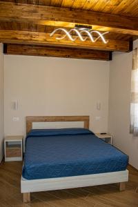 Una cama o camas en una habitación de L'Antica Fontana - Casa Vacanze B&B