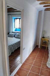 A bed or beds in a room at Casa del Arrabal