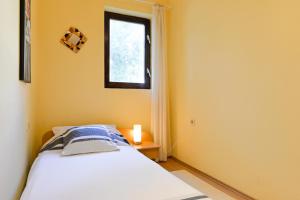 Posteľ alebo postele v izbe v ubytovaní Apartments Doda
