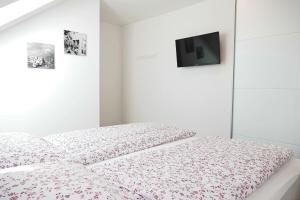 Łóżko lub łóżka w pokoju w obiekcie Appartement Mauterndorf