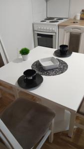 Kuchyň nebo kuchyňský kout v ubytování Apartman Sunce