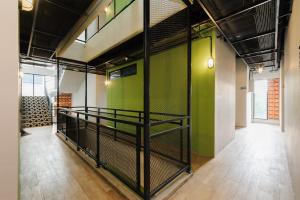 a room with a cage in the middle of a building at Sans Stay Caverna Gandaria in Jakarta