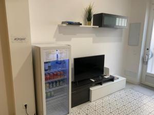 a refrigerator filled with drinks in a room at Galileo apartment in Madrid