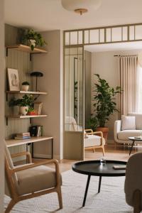 a living room with chairs and a table at Villa Saltic in Grzybowo +70 photos