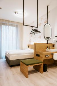 Postelja oz. postelje v sobi nastanitve BEE GREEN Linz Self-Check-in-Hotel