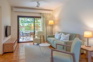 a living room with a couch and a table at Royal Sunset Beach Club in Adeje