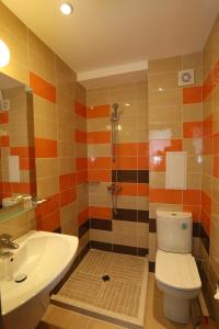 a bathroom with a toilet and a sink at Sunny Residence complex in Sunny Beach +33 photos