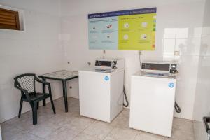 a room with two machines and a table and a sign at Royal Sunset Beach Club in Adeje