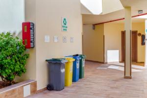 a row of trash cans sitting next to a building at Royal Sunset Beach Club in Adeje