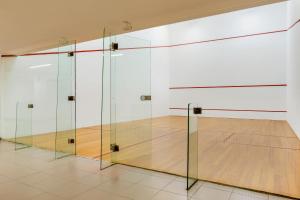 a gym with a basketball court and a glass wall at Royal Sunset Beach Club in Adeje