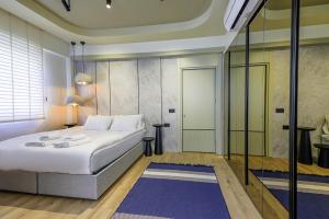 a bedroom with a large bed and a glass wall at Flat w Pool Garden 3 min to Beach in Antalya in Antalya