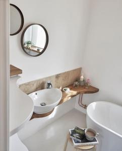 a bathroom with a sink and a mirror at The Barn - Georgeham North Devon in Braunton