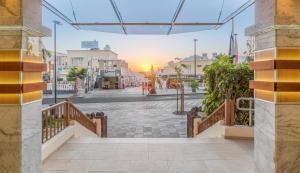 a view of a city street with the sun setting at Royal Sunset Beach Club in Adeje